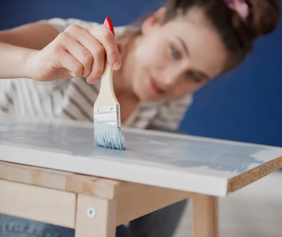 A Woman Painting Over Ikea Furniture